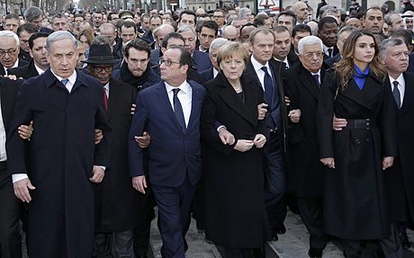 French President Hollande is surrounded by heads of state as they attend the solidarity march in the streets of Paris