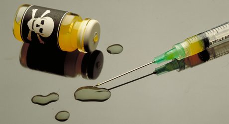 poison and plastic syringe. Toxic ampule.